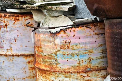 Image of rusty metal barrels