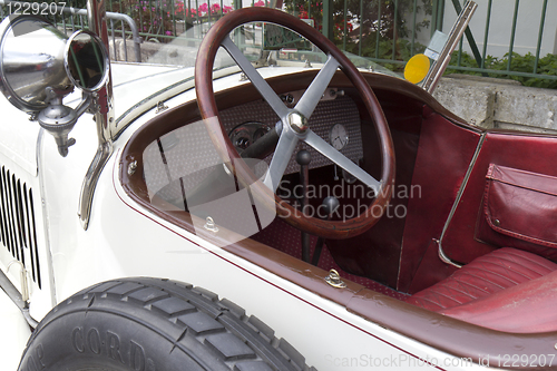 Image of White vintage car.