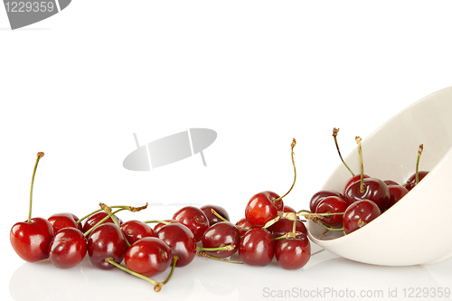 Image of Sweet red cherries and ceramic bowl