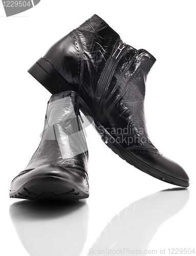 Image of Pair of leather mens boots on white 