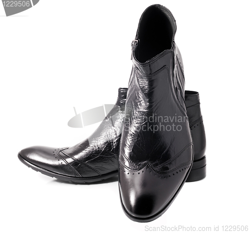 Image of Pair of Black leather mens boots on white