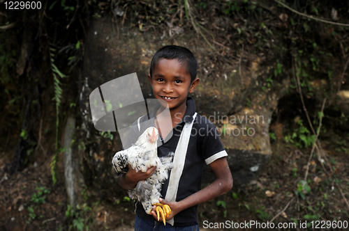 Image of Boy with  chicken