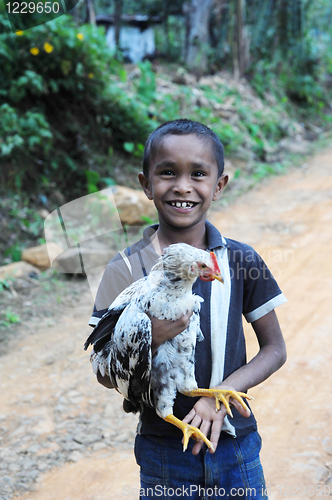 Image of Boy with  chicken