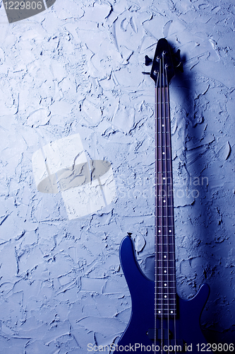 Image of blue bass guitar