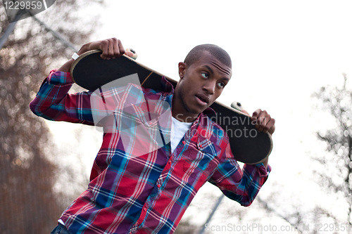 Image of Skateboarding Guy Taking a Break