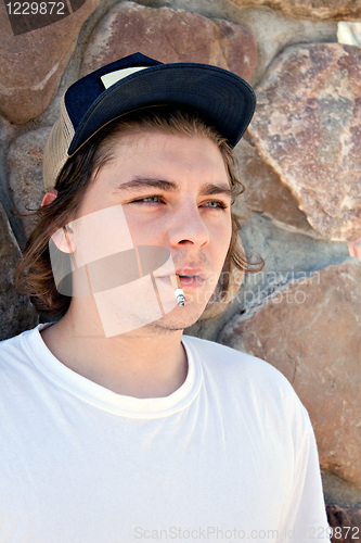 Image of Young Man Smoking a Cigarette