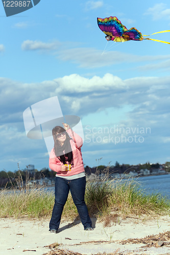 Image of Girl Flies a Kite at the Sea Shore