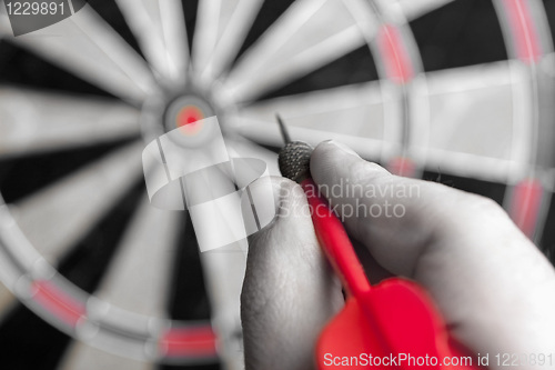 Image of Hand Holding a Dart