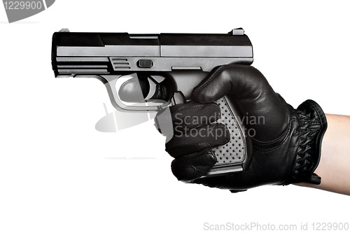Image of Hand Pointing a Black Handgun 