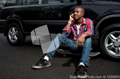 Image of Skateboarding Guy Talking on the Phone