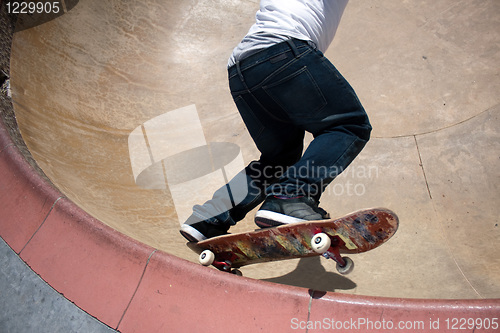 Image of Skateboarder Skating Inside the Bowl