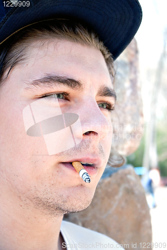 Image of Young Man Smoking a Cigarette