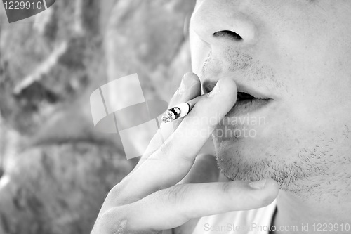 Image of Young Man Smoking a Cigarette