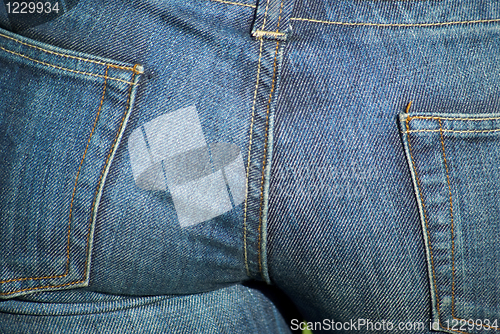 Image of Female buttocks in jeans close-up