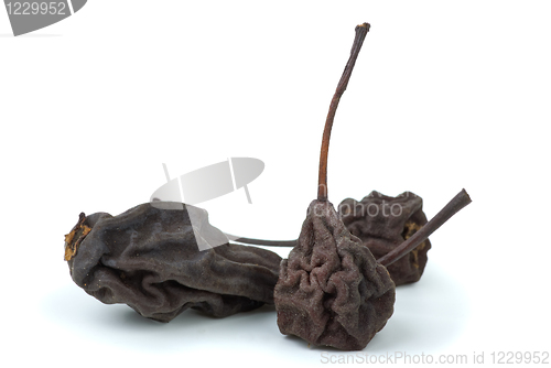 Image of Three dried smoked pears isolated on the white background