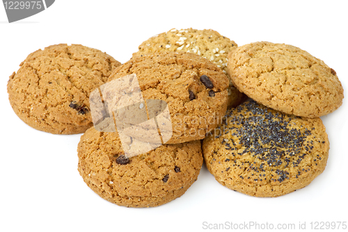 Image of Few oatmeal cookies (with raisins, sesame and poppy seeds) isolated on the white background