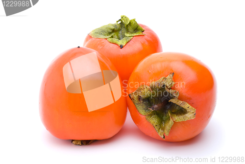 Image of Three persimmons