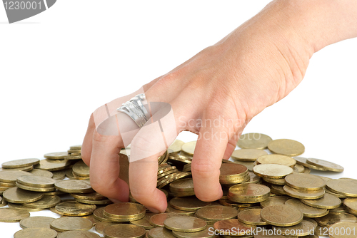 Image of Hand grabbing coins from the pile