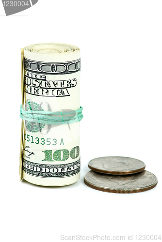 Image of Roll of $100 banknotes tightened with rubber band and two coins