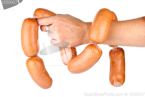 Image of Hand holding sausages chain isolated on the white background