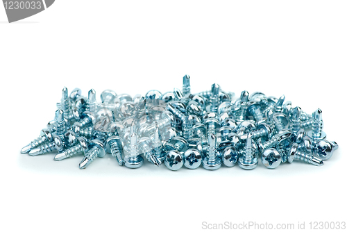 Image of Pile of small silver colored metal screws