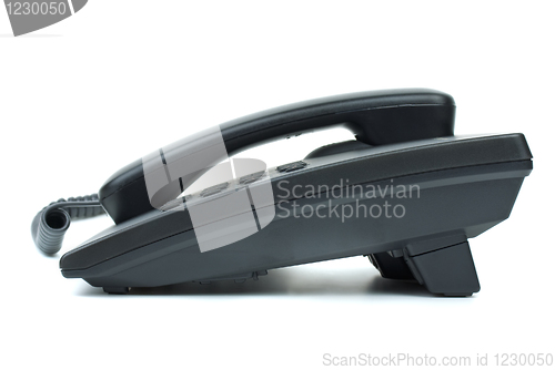 Image of Black office phone. Side view