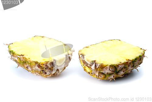 Image of Two pineapple halves