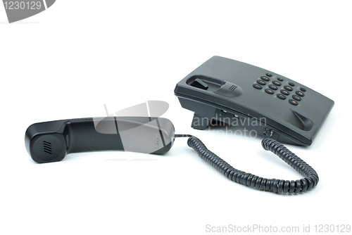 Image of Black office phone with handset near