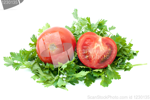 Image of Ripe red tomato and half with some parsley