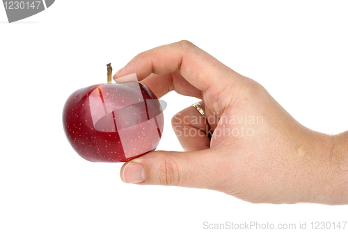 Image of Hand taking red apple