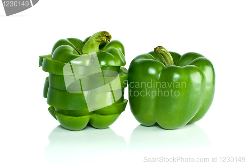 Image of Whole green sweet pepper and few slices