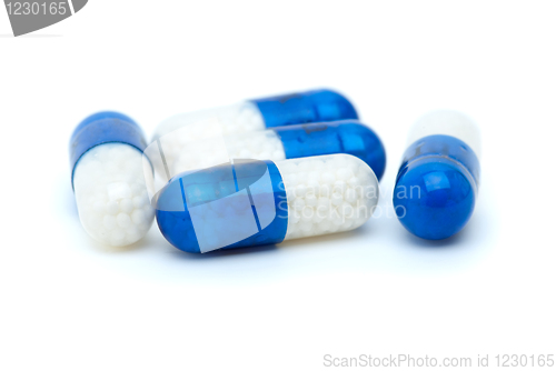 Image of Four white-blue pills