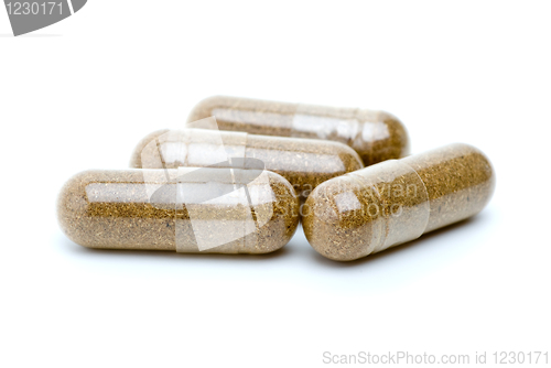 Image of Four homeopathyc brown pills