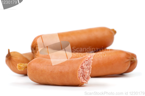 Image of Few whole and one half-eaten sausages