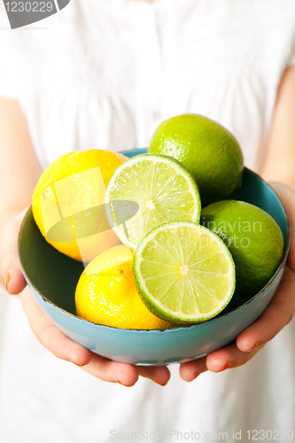 Image of Woman with lemon and lime