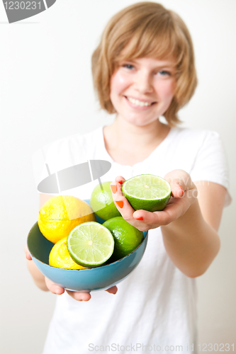 Image of Woman with lemon and lime