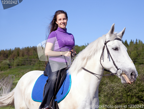 Image of Girl on a white horse