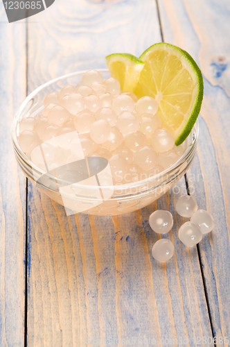 Image of tapioca pearls with lime. white bubble tea ingredients