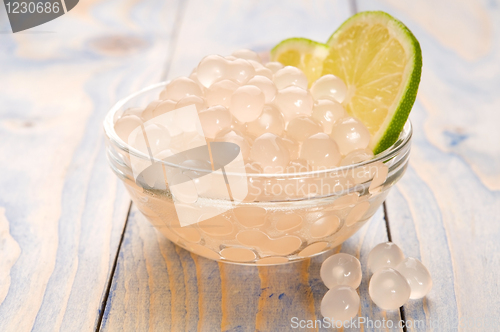 Image of tapioca pearls with lime. white bubble tea ingredients