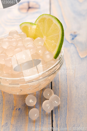 Image of tapioca pearls with lime. white bubble tea ingredients