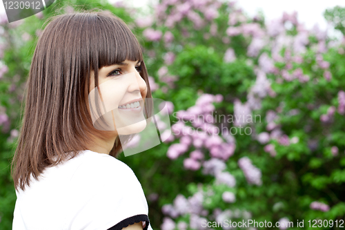 Image of young woman in the lilac park