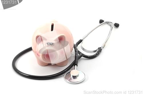 Image of stethoscope and piggy bank