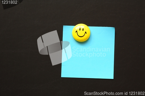 Image of smiley and paper with copyspace