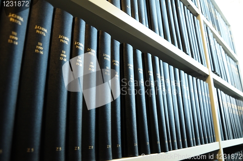 Image of old books in a library