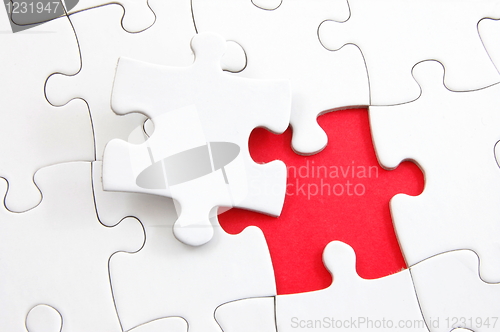 Image of blank puzzle with missing piece