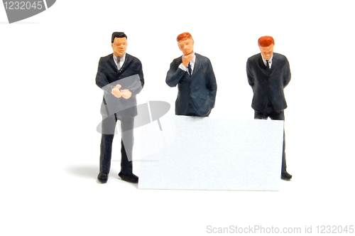 Image of business people with banner