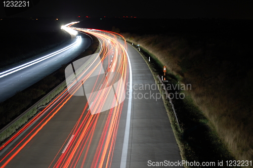 Image of highway at night with traffic