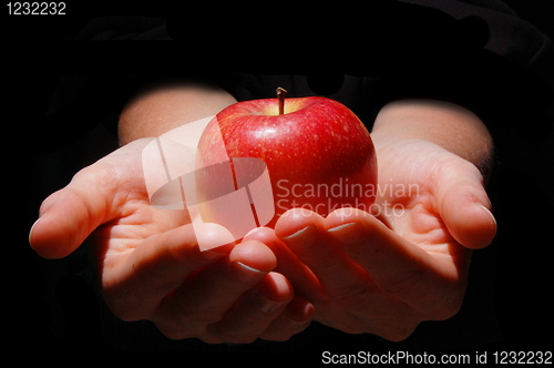 Image of hand with apple
