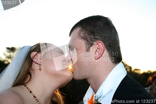 Image of Wedding Couple kissing