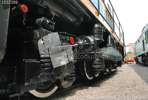 Image of   train stands on railroad tracks 